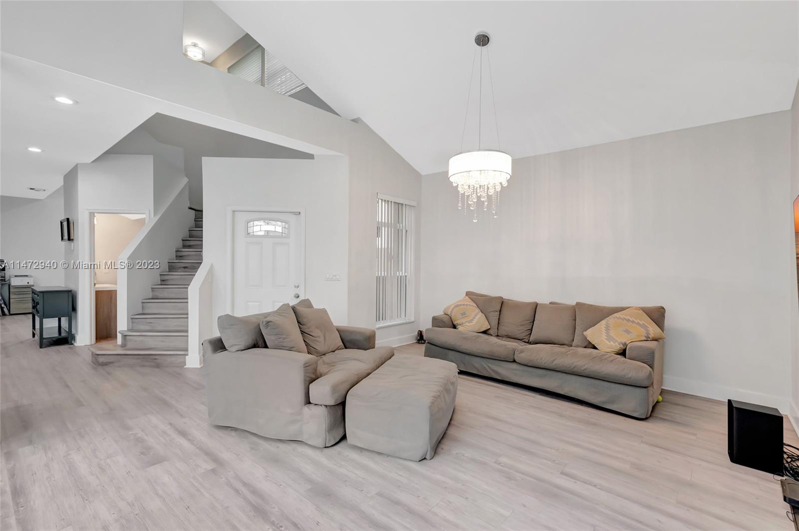6636 Northwest 25th Avenue Boca Raton, FL 33496 - Photo 28 of 96 a living room with furniture and a wooden floor