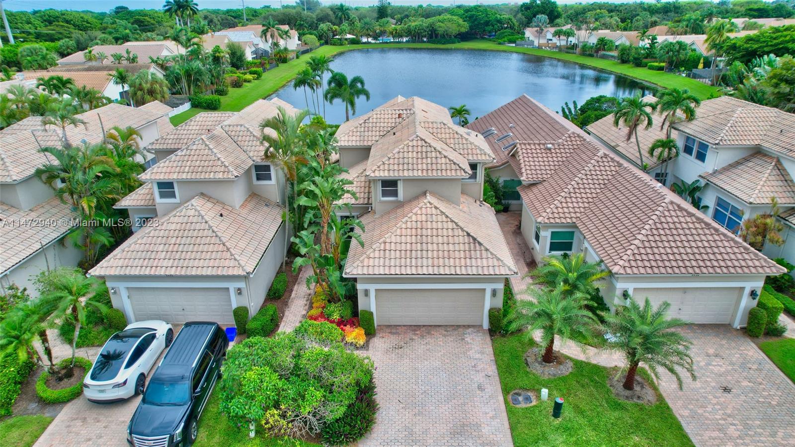 6636 Northwest 25th Avenue Boca Raton, FL 33496 - Photo 3 of 96 an aerial view of a house with outdoor space and lake view