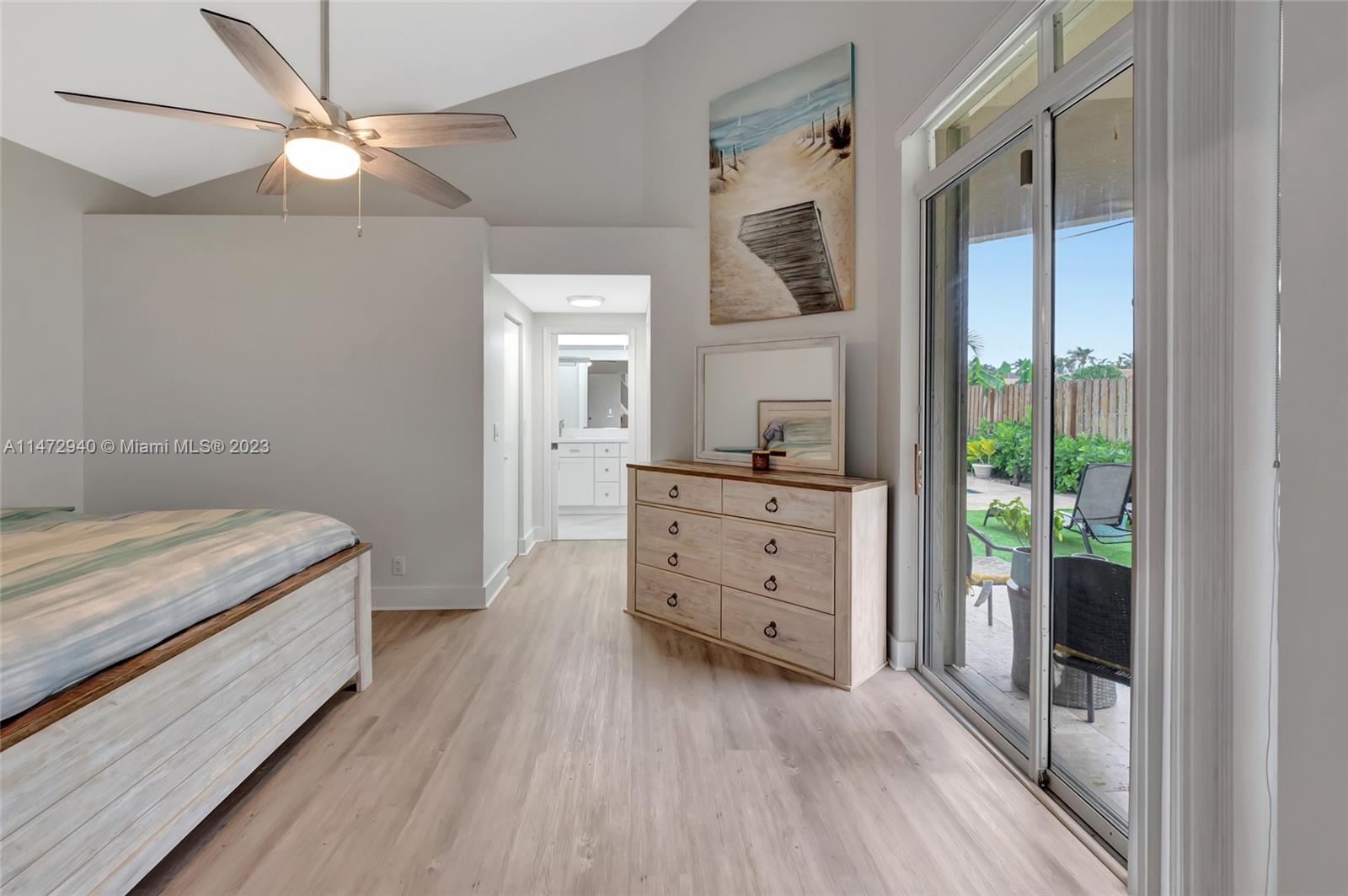 6636 Northwest 25th Avenue Boca Raton, FL 33496 - Photo 32 of 96 a room with a bed and a dresser