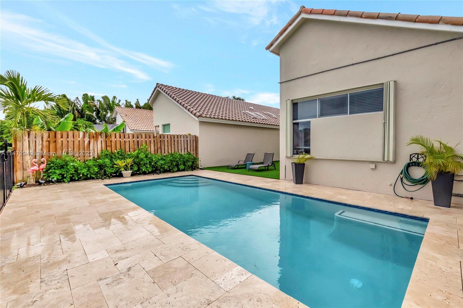 6636 Northwest 25th Avenue Boca Raton, FL 33496 - Photo 56 of 96 a view of swimming pool with outdoor seating