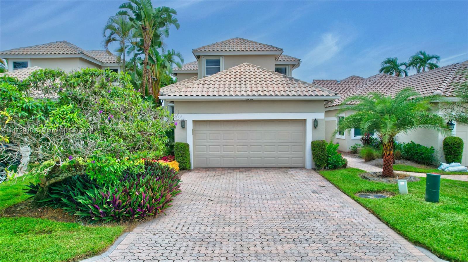 6636 Northwest 25th Avenue Boca Raton, FL 33496 - Photo 74 of 96 a front view of a house with garden