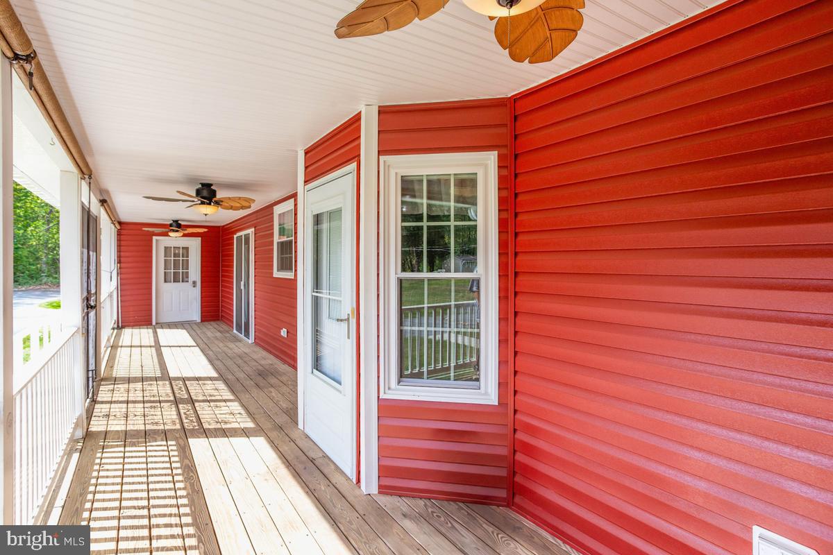 400 Adelina Road Prince Frederick, MD 20678 - Photo 6 of 57 Charming red porch with inviting views.