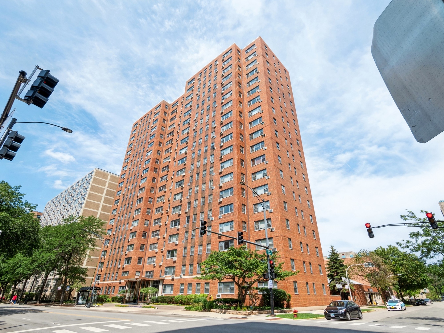 2909 North Sheridan Road, Unit 808 Chicago, IL 60657 - Photo 1 of 1 a view of a tall building next to a road