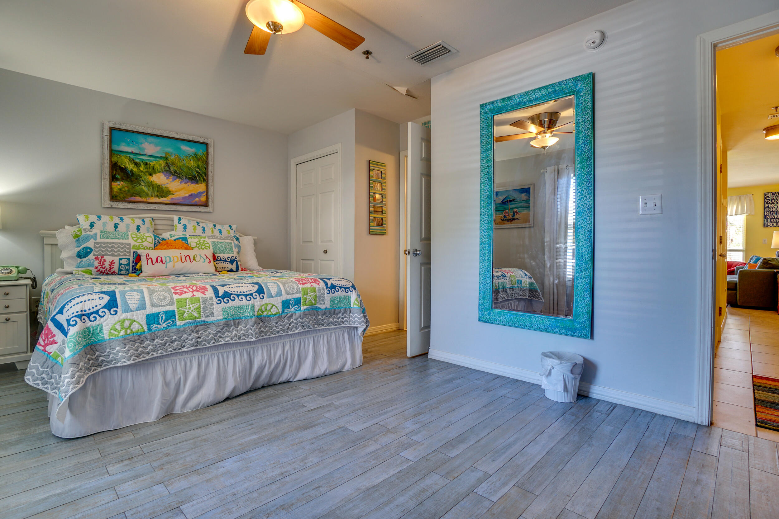144 Spires Lane, Unit 107 Santa Rosa Beach, FL 32459 - Photo 11 of 17 a bedroom with furniture and a wooden floor