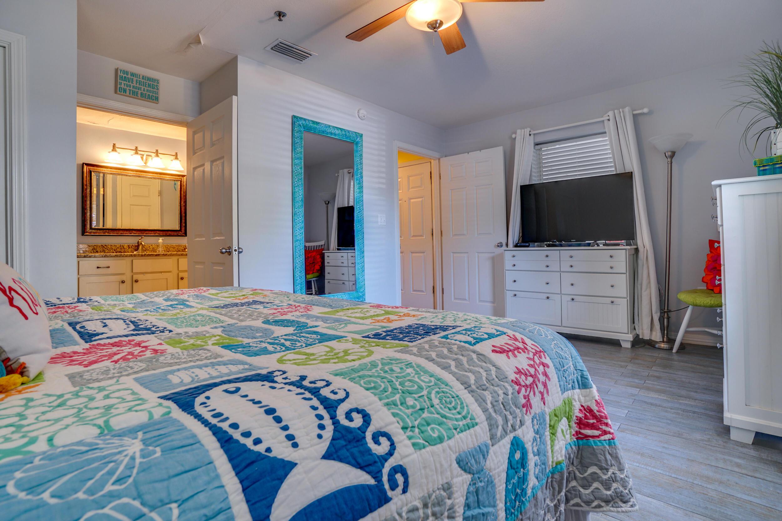 144 Spires Lane, Unit 107 Santa Rosa Beach, FL 32459 - Photo 12 of 17 a bedroom with a bed and a flat screen tv