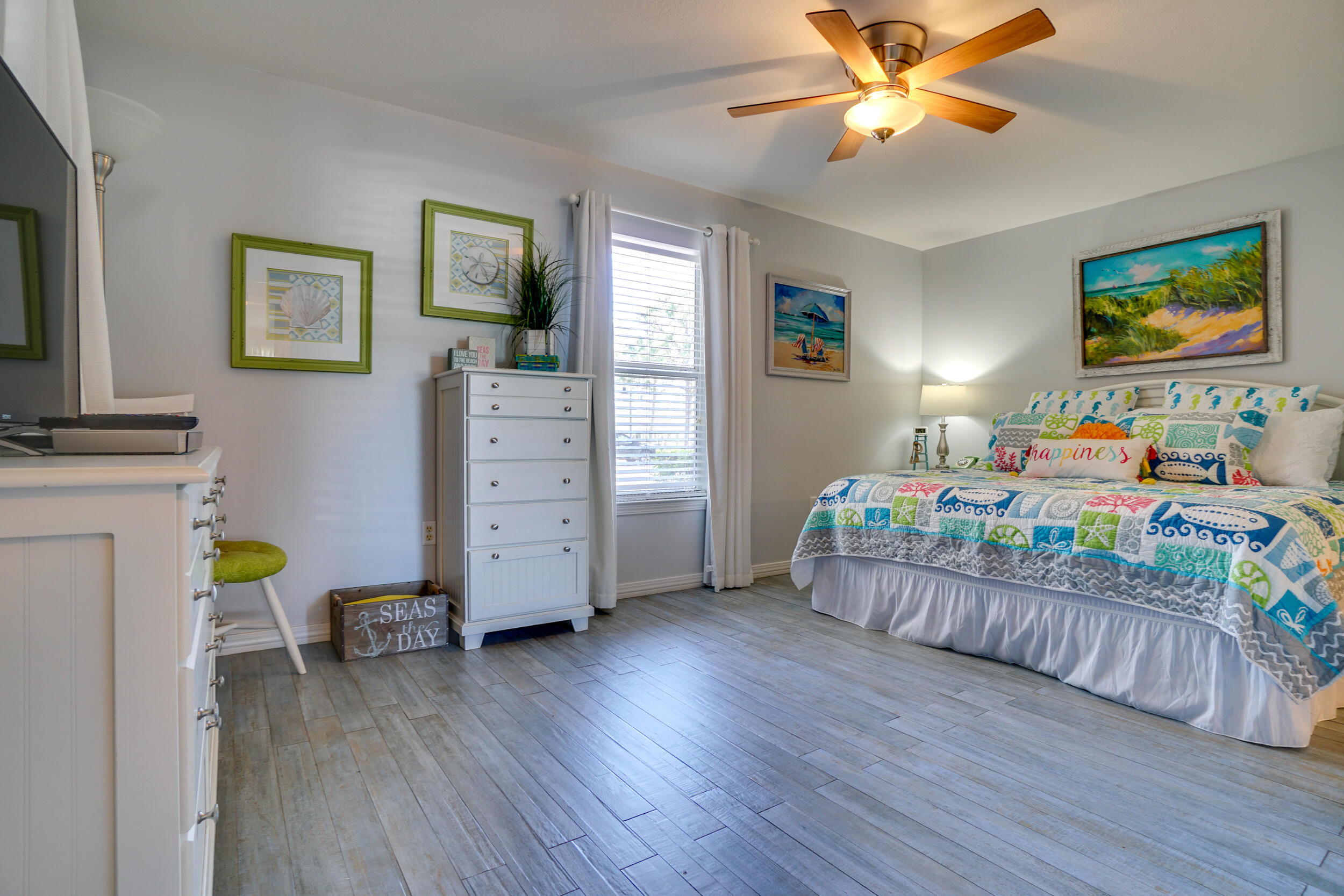 144 Spires Lane, Unit 107 Santa Rosa Beach, FL 32459 - Photo 13 of 17 a bedroom with furniture and a wooden floor