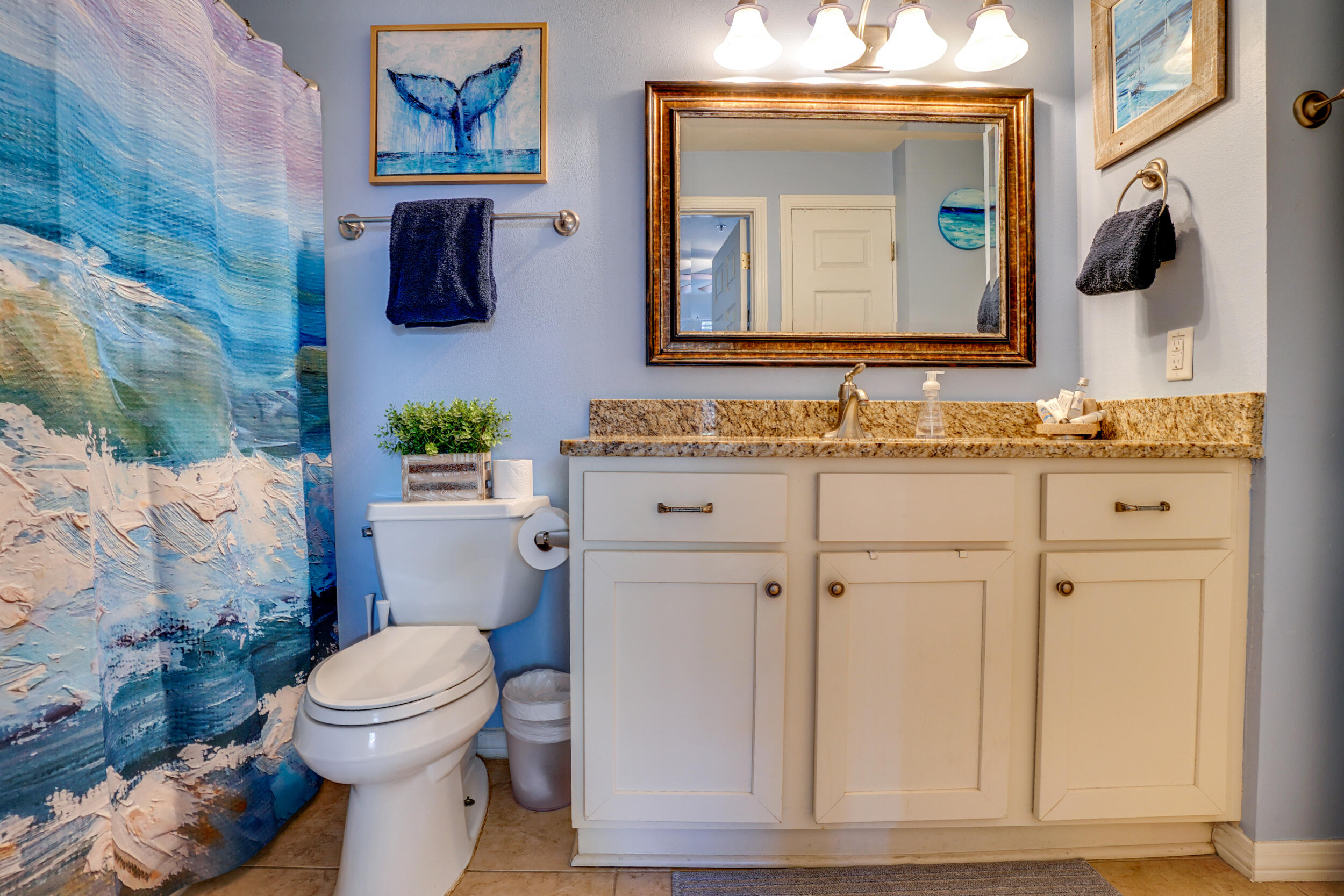 144 Spires Lane, Unit 107 Santa Rosa Beach, FL 32459 - Photo 14 of 17 a bathroom with a toilet a sink and mirror