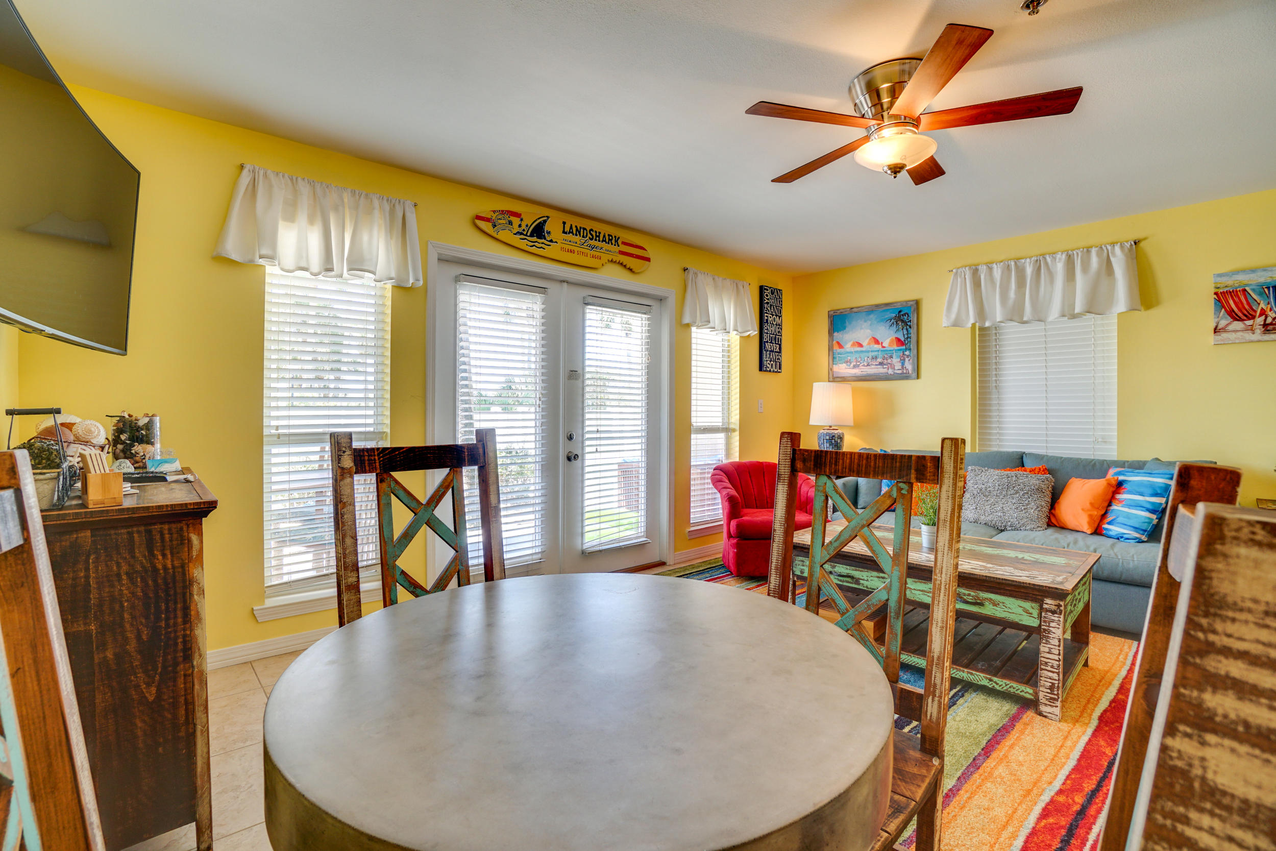 144 Spires Lane, Unit 107 Santa Rosa Beach, FL 32459 - Photo 3 of 17 a view of a dining room with furniture and wooden floor