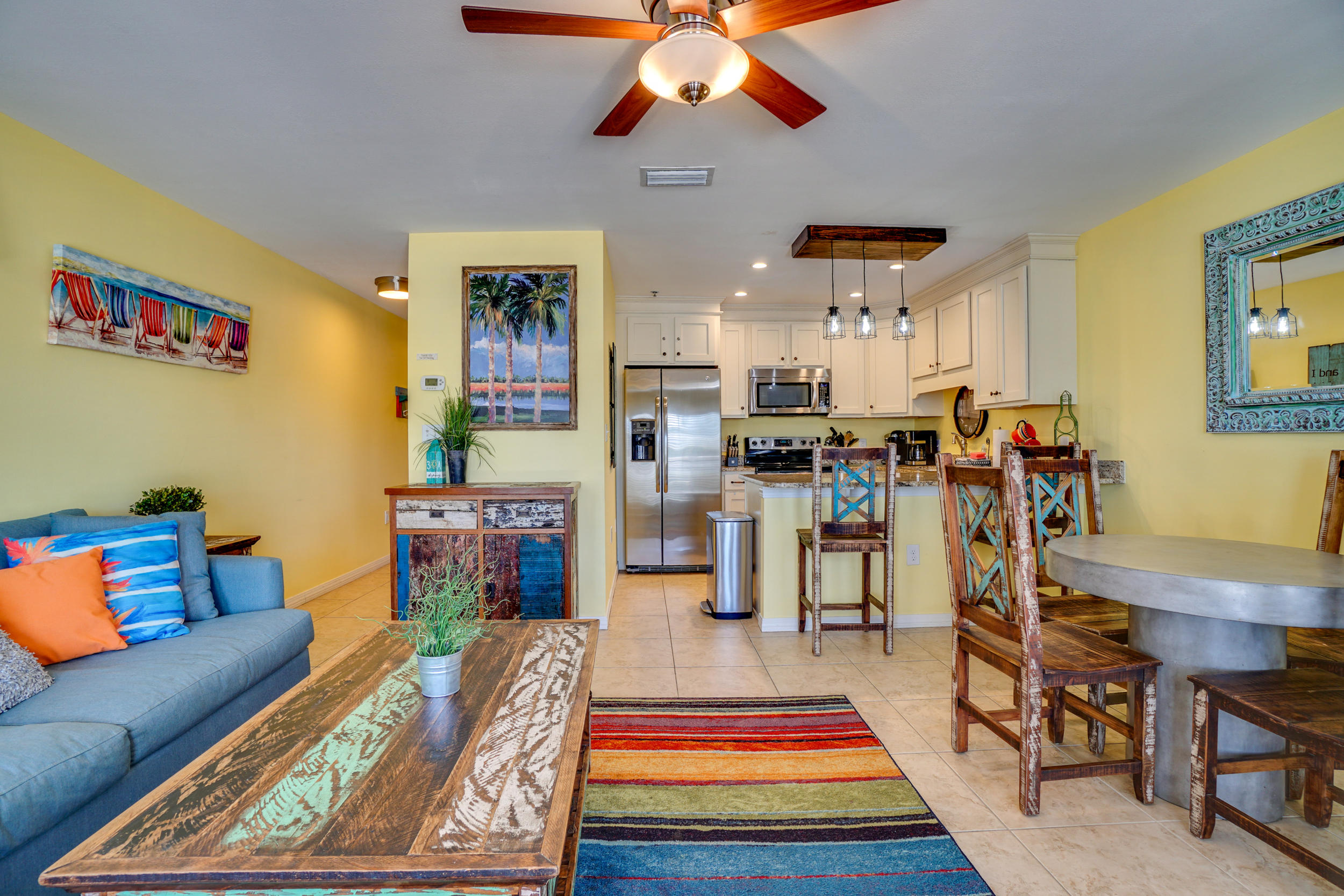 144 Spires Lane, Unit 107 Santa Rosa Beach, FL 32459 - Photo 5 of 17 a living room with furniture and wooden floor