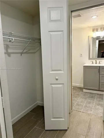 a bathroom with a shower and a sink