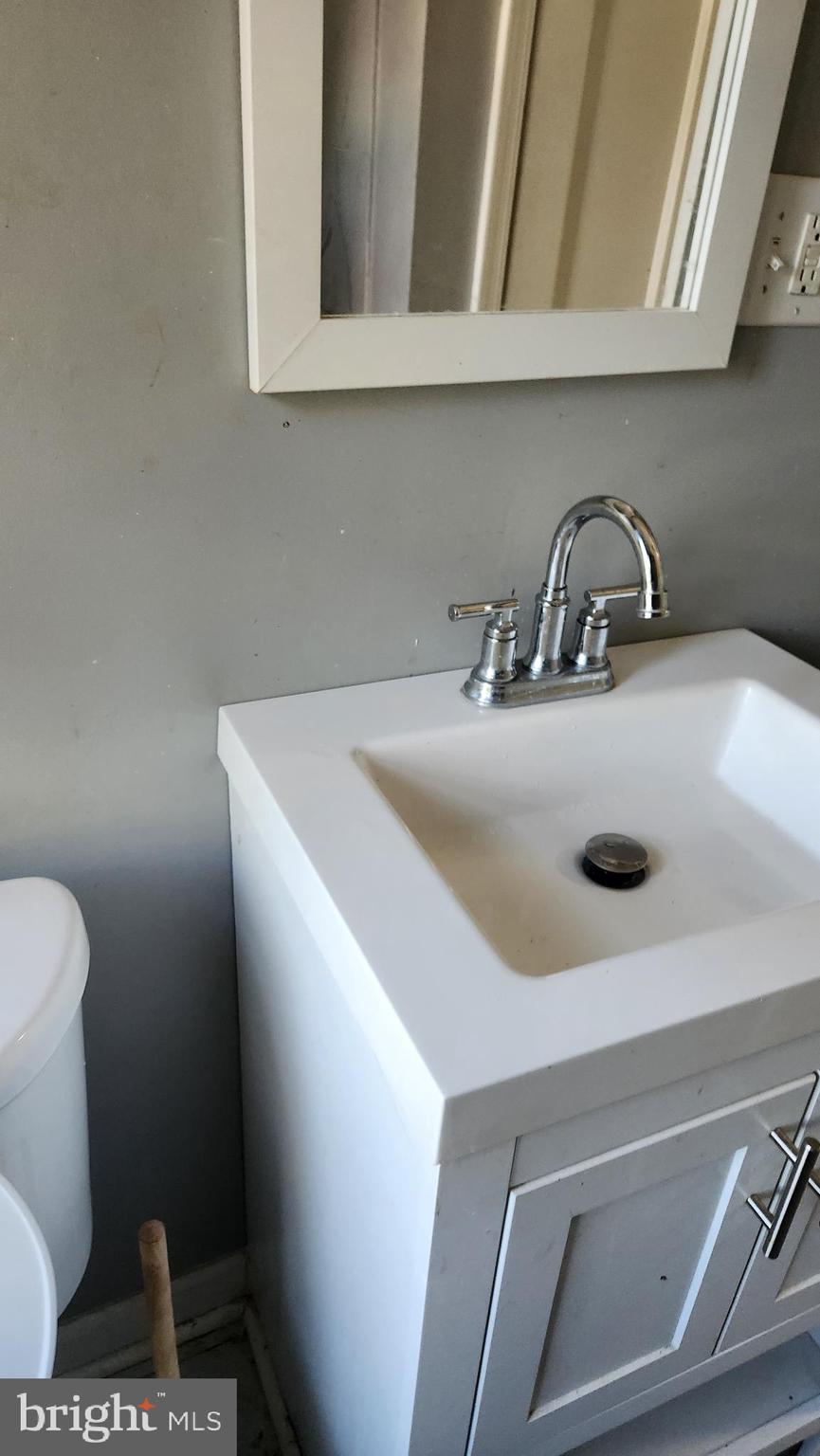 1024 Wicklow Road Baltimore, MD 21229 - Photo 28 of 44 a close view of sink and a toilet