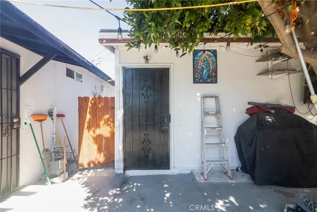 a view of a entryway door with wooden floor