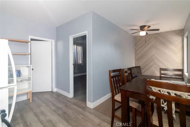 a view of a dining room with furniture and a chandelier