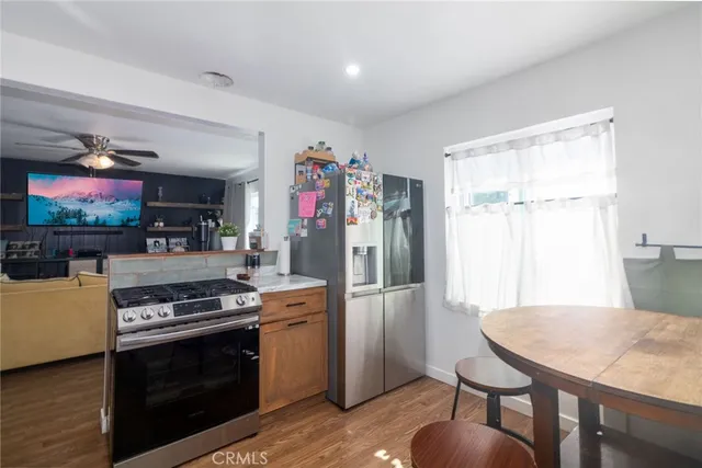 a kitchen that has a table and chairs in it