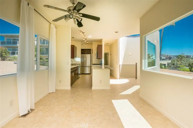 a view of a hallway with a chandelier