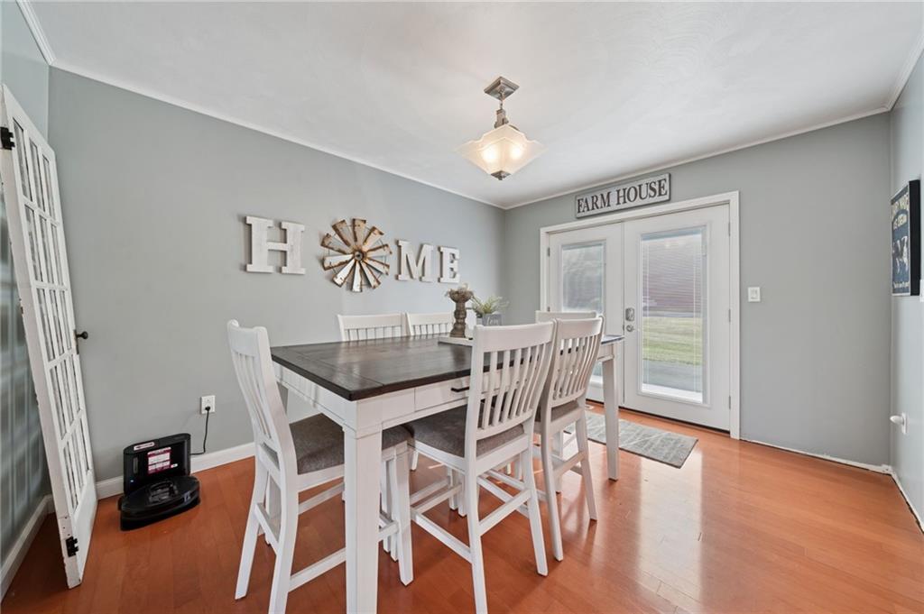 5 Trice Drive Mount Pleasant, PA 15666 - Photo 16 of 47 a view of a dining room with furniture and wooden floor