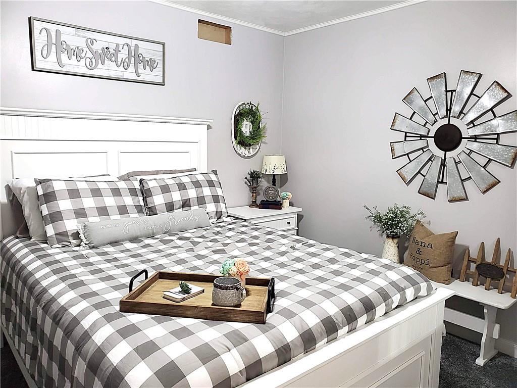 5 Trice Drive Mount Pleasant, PA 15666 - Photo 22 of 47 a bedroom with a bed and painting on the wall