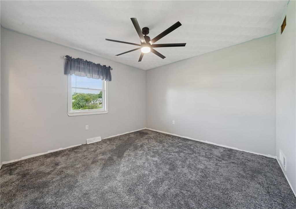 5 Trice Drive Mount Pleasant, PA 15666 - Photo 26 of 47 an empty room with windows and ceiling fan