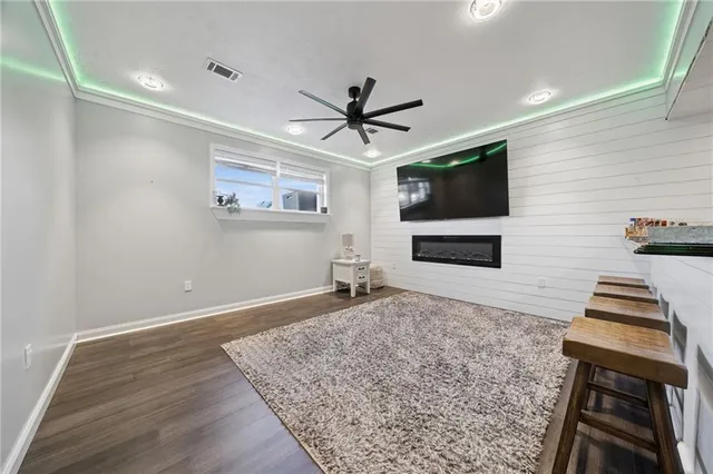 a living room with couch and a flat screen tv