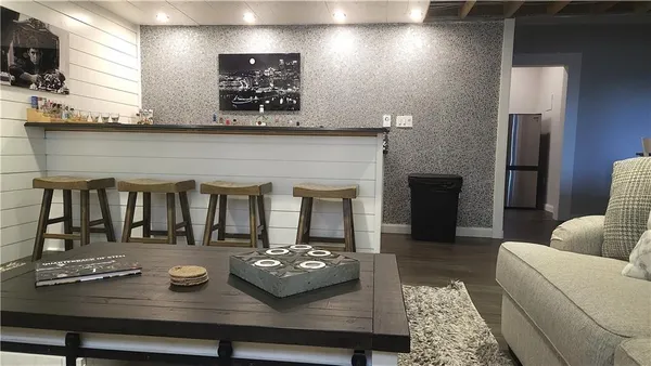 a living room with furniture and flat screen tv