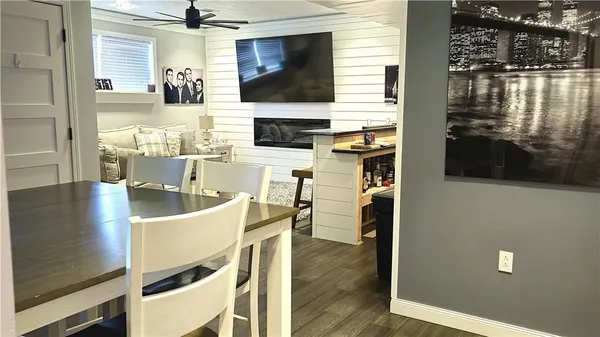 a view of a dining room with furniture window and wooden floor