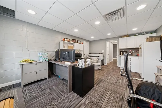 a kitchen with a sink appliances and cabinets