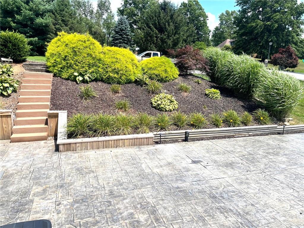 5 Trice Drive Mount Pleasant, PA 15666 - Photo 42 of 47 a view of a garden with an outdoor seating