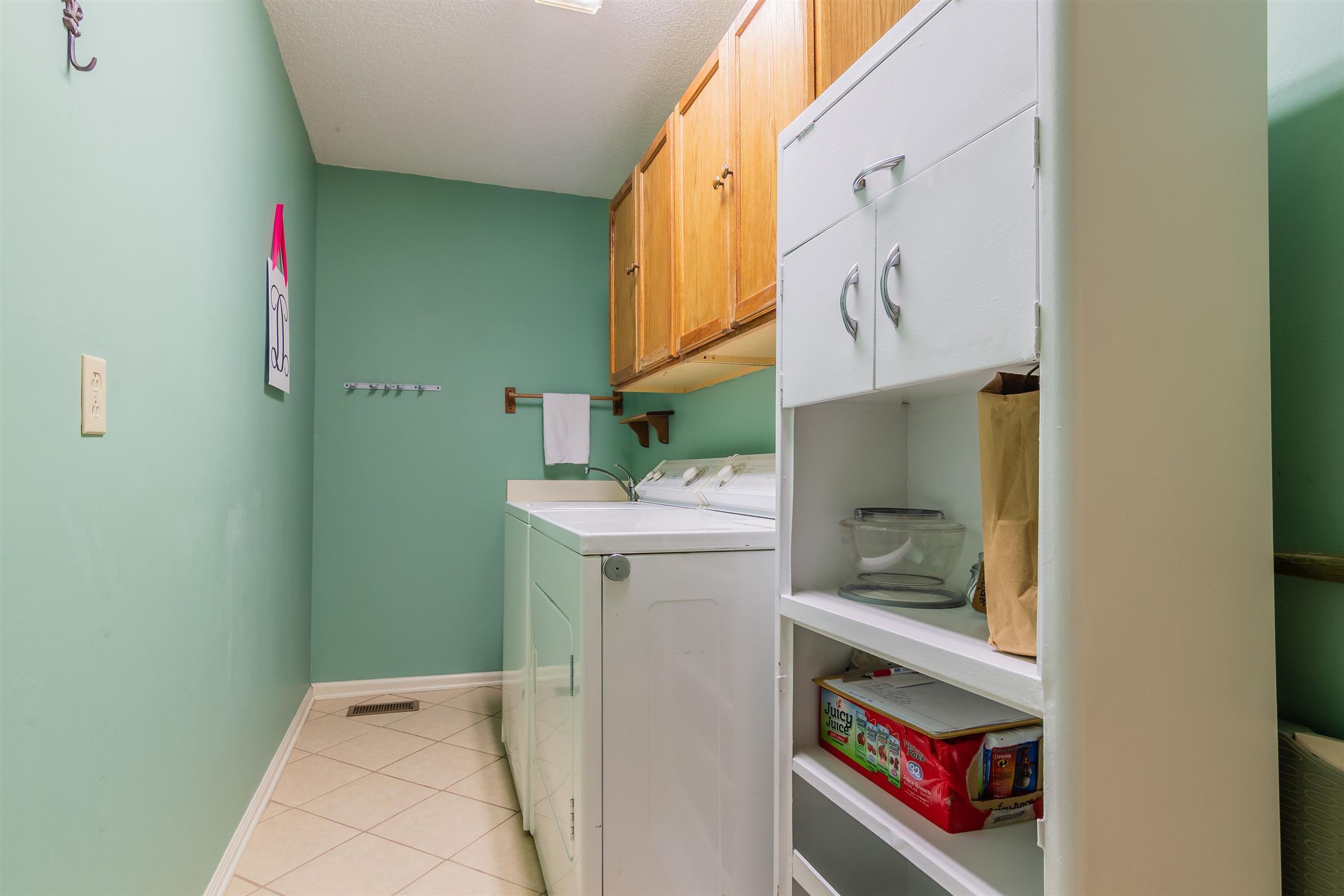2842 Sulphur Springs Road Murfreesboro, TN 37129 - Photo 12 of 28 Laundry area with tile and built-in cabinets for storage