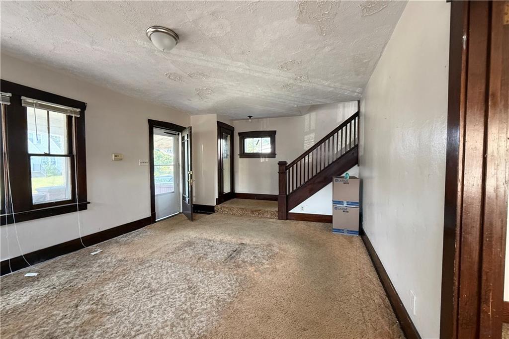 1045 Myrtle Place Sharon, PA 16146 - Photo 4 of 16 wooden floor in an empty room with a window