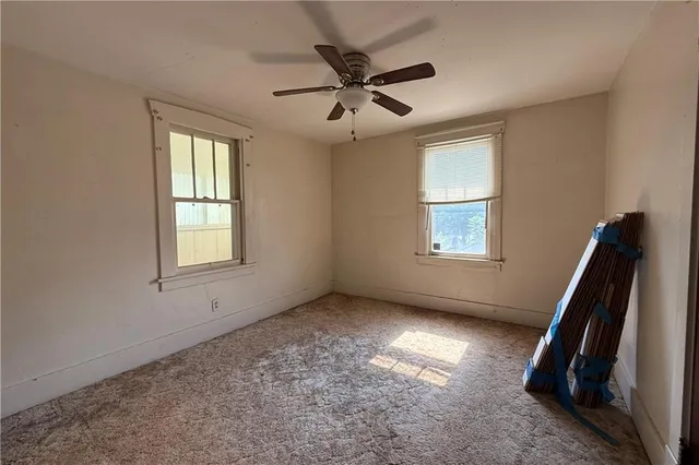 a view of empty room with windows