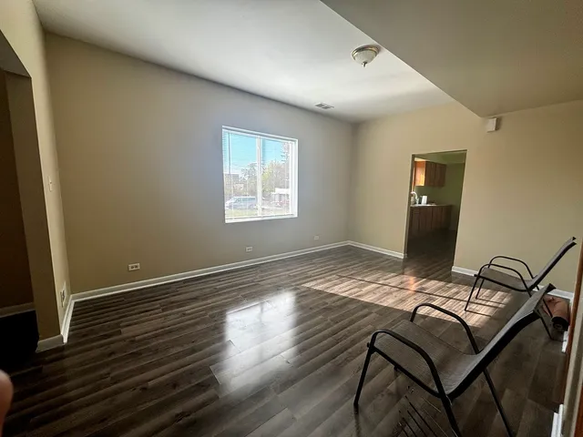 a view of a livingroom with furniture and wooden floor