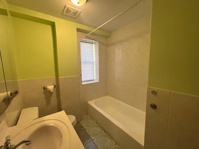 a bathroom with a sink and a shower