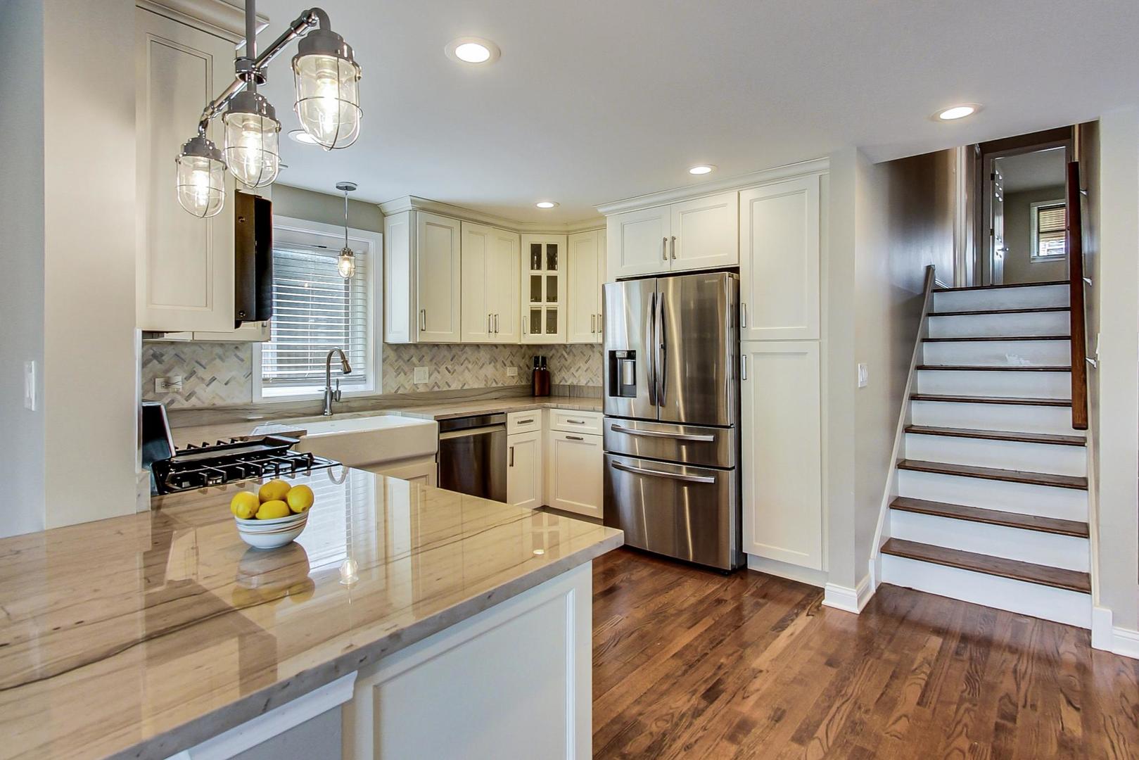 3702 South Normal Avenue Chicago, IL 60609 - Photo 11 of 36 a kitchen with granite countertop stainless steel appliances a sink and counter space