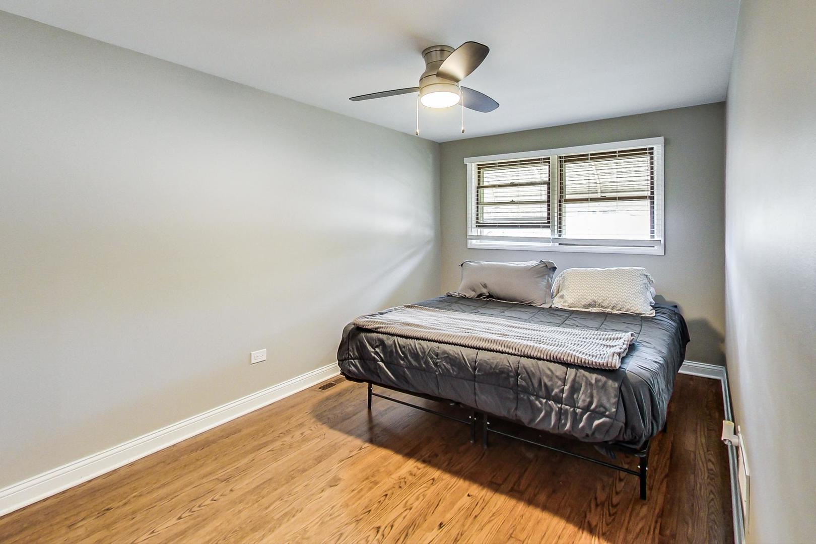 3702 South Normal Avenue Chicago, IL 60609 - Photo 12 of 36 a bedroom with a bed and a window