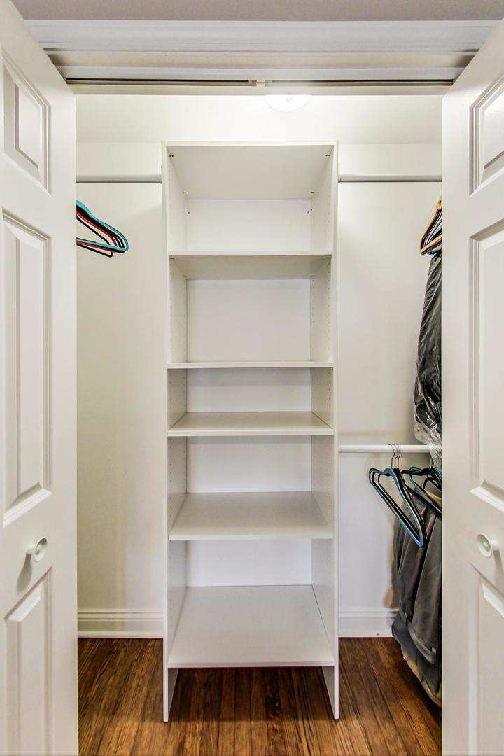 3702 South Normal Avenue Chicago, IL 60609 - Photo 14 of 36 a view of walk in closet with empty racks