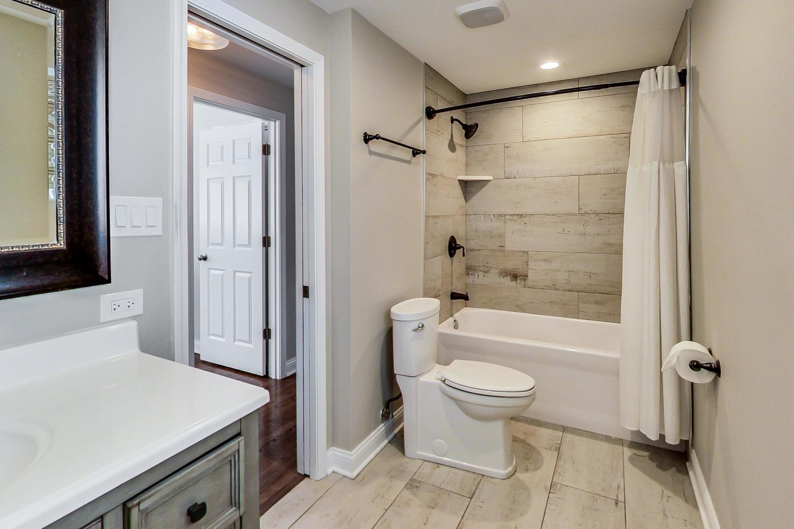 3702 South Normal Avenue Chicago, IL 60609 - Photo 15 of 36 a bathroom with a sink toilet and shower