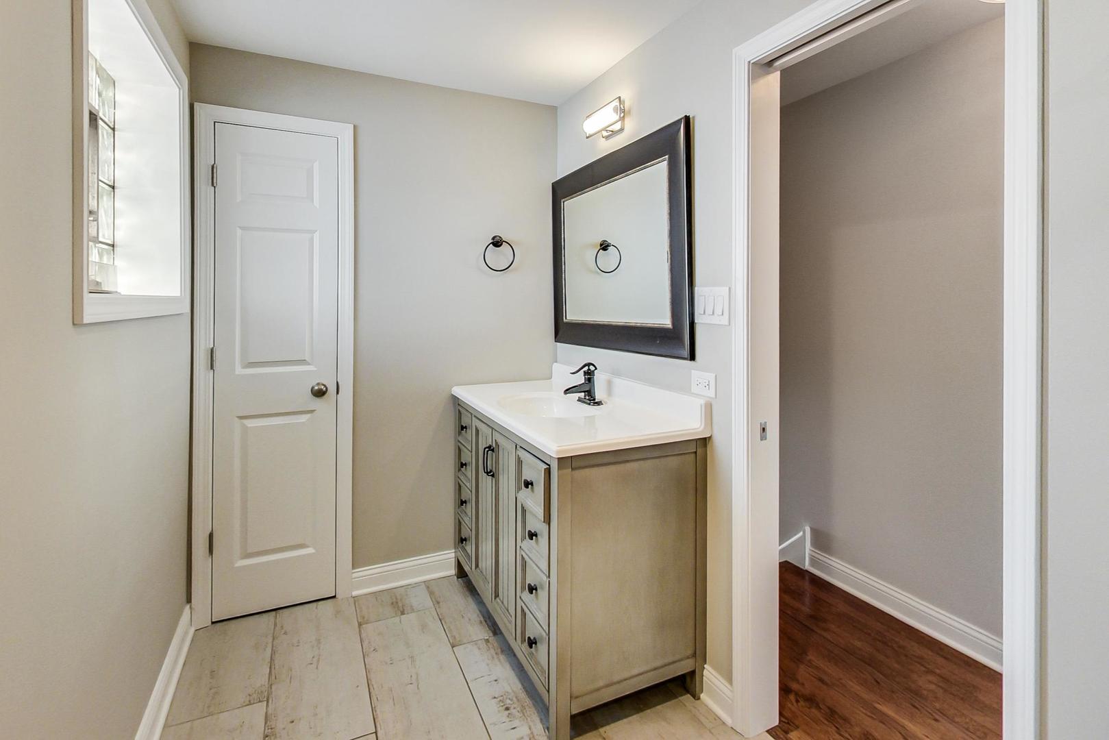 3702 South Normal Avenue Chicago, IL 60609 - Photo 16 of 36 a view of bathroom with dual sinks