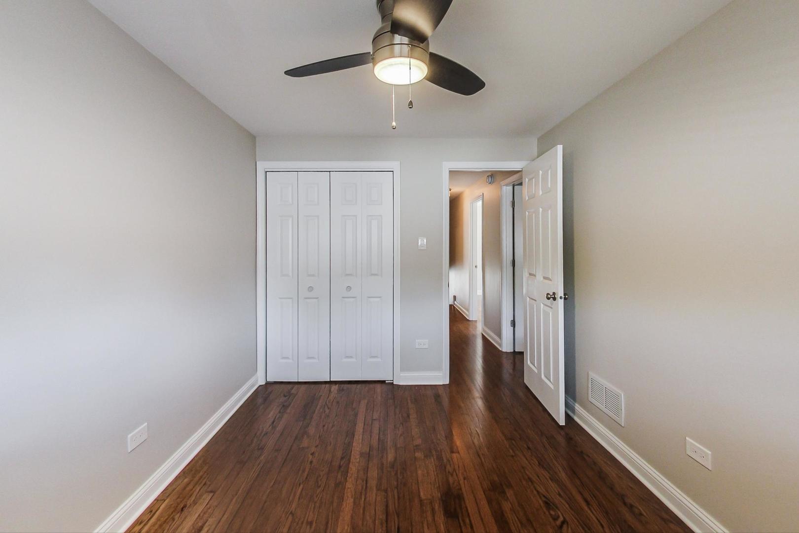 3702 South Normal Avenue Chicago, IL 60609 - Photo 18 of 36 a view of an empty room and wooden floor