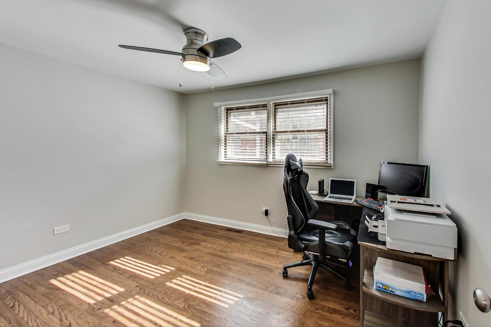 3702 South Normal Avenue Chicago, IL 60609 - Photo 19 of 36 a view of workspace with wooden floor and windows