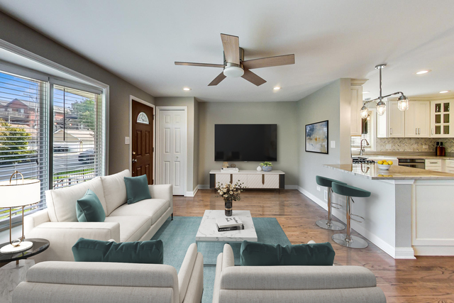 3702 South Normal Avenue Chicago, IL 60609 - Photo 2 of 36 a living room with furniture and a flat screen tv
