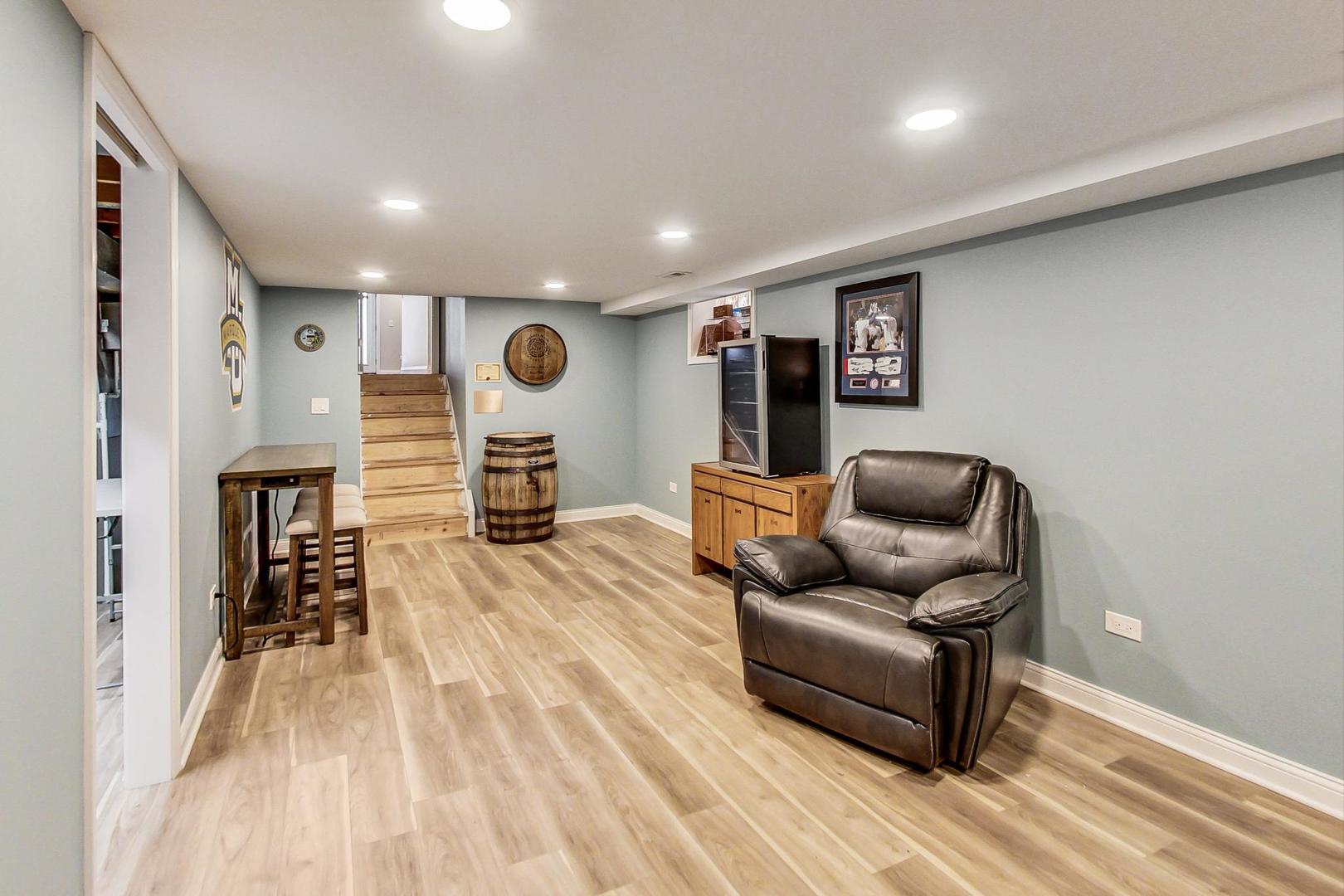 3702 South Normal Avenue Chicago, IL 60609 - Photo 26 of 36 a living room with furniture and a wooden floor