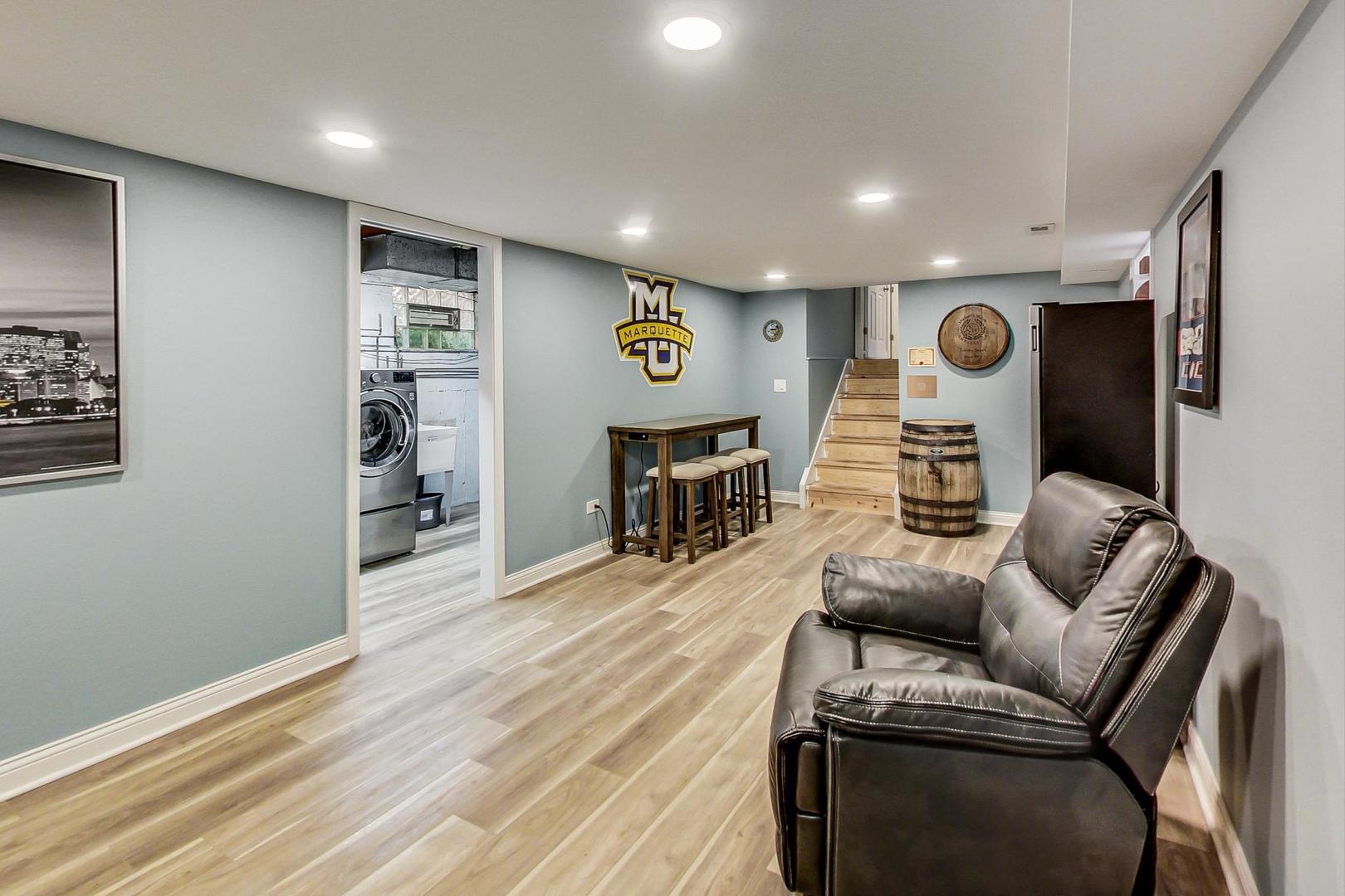 3702 South Normal Avenue Chicago, IL 60609 - Photo 27 of 36 a living room with furniture and a wooden floor