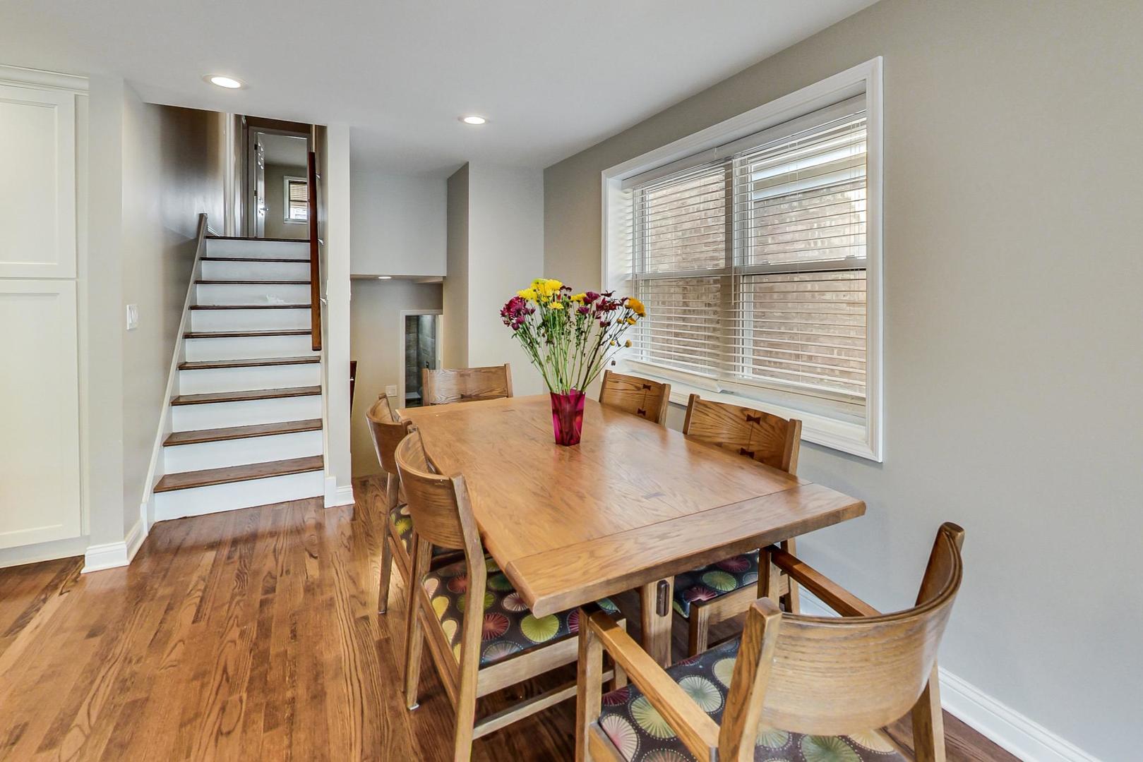 3702 South Normal Avenue Chicago, IL 60609 - Photo 6 of 36 a view of a dining room with furniture and wooden floor