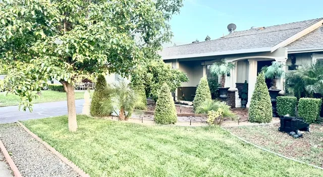 a front view of a house with garden