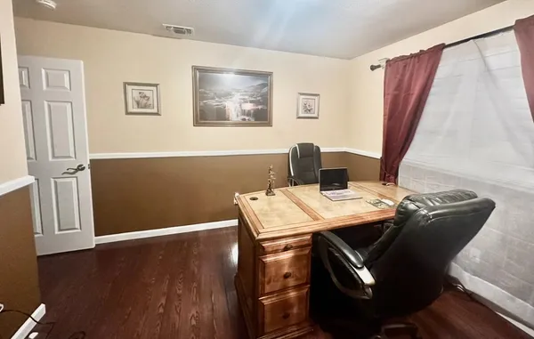 a bathroom with a toilet a sink and a mirror