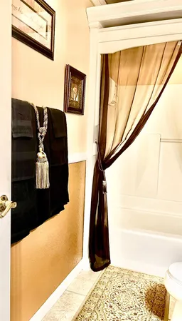 a living room with furniture and flowers