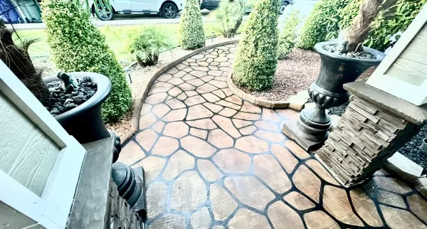 a front view of a house with fountain