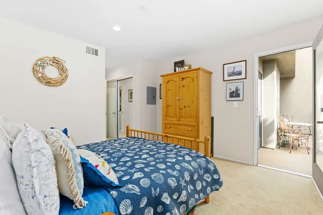 a bedroom with a bed and a table in it