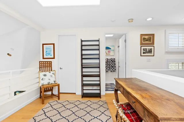 a bedroom with furniture and window