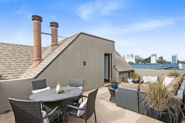 a patio with table and chairs